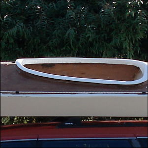 Stitch panel kayak on car